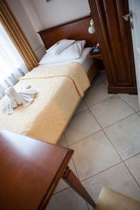 Postel nebo postele na pokoji v ubytování Hotel Baden