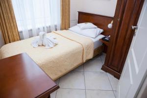 Postel nebo postele na pokoji v ubytování Hotel Baden