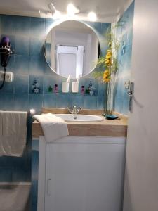 a bathroom with a sink and a mirror at Casa Rosella in Sant Ferran de Ses Roques