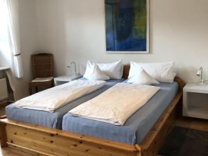מיטה או מיטות בחדר ב-Haus am Bühl