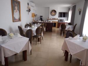 a dining room table and chairs in a room at Boutique Hostal Mistral in Cala d´Or