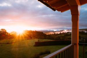 a view of the sunset from the porch of a house at el gran sueño Boutique Hotel & Apartamentos - Adults Only in Pintueles
