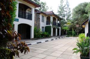 a house with a courtyard in front of it at The Noble Hotel & Conference Centre in Eldoret