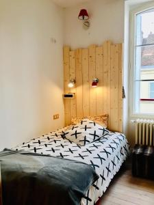 מיטה או מיטות בחדר ב-Chambres d'hôtes Le 42