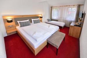 Postel nebo postele na pokoji v ubytování Vico's Hotel & Restaurant Asperg