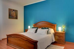 Ein Bett oder Betten in einem Zimmer der Unterkunft Apartments Villa Delia
