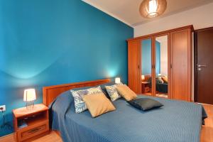 Ein Bett oder Betten in einem Zimmer der Unterkunft Apartments Villa Delia