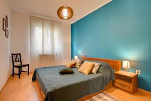 Ein Bett oder Betten in einem Zimmer der Unterkunft Apartments Villa Delia
