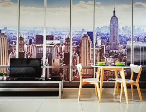 a dining room with a view of the city at KSL D'esplanade Johor Bharu in Johor Bahru