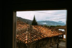a view of a tile roof of a building at el gran sueño Boutique Hotel & Apartamentos - Adults Only in Pintueles
