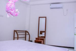 Postel nebo postele na pokoji v ubytování Pearl Holiday Inn