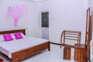 Postel nebo postele na pokoji v ubytování Pearl Holiday Inn