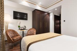 TV a/nebo společenská místnost v ubytování Áurea Legends by Eurostars Hotel Company
