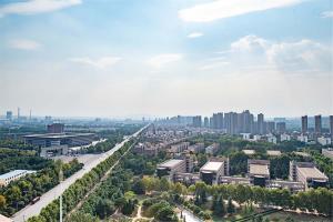 an aerial view of a city with tall buildings at Luoyang Luolong·Dazhao International Plaza in Luoyang