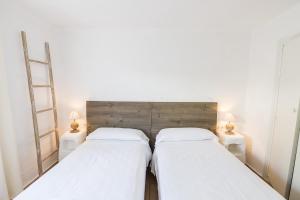 Posteľ alebo postele v izbe v ubytovaní Villa Bini Andu