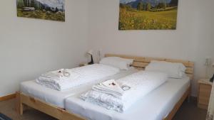 Gulta vai gultas numurā naktsmītnē Alpina Apartments - Zell am See