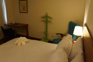 Katil atau katil-katil dalam bilik di Atrium Miraflores Hotel