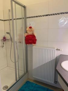 a bathroom with a shower and a sink at Villa Pazelt Top1 in Bad Vöslau +16 photos