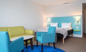 Кровать или кровати в номере Thon Hotel Hammerfest