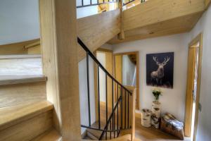 a staircase in a house with wooden ceilings at Chalet les Tissourds in Chamonix