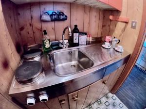 a kitchen with a sink and a counter top at La finestra sulla Via Lattea in Sestriere