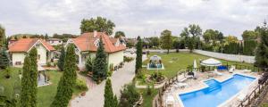 an aerial view of a house with a swimming pool at Dio Apartmanok in Balatonboglár