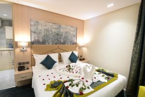 Postel nebo postele na pokoji v ubytování Touq Al Balad Hotel - فندق توق البلد + 37 fotografií