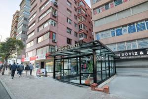 a bus stop on a city street with buildings at White Monarch Hotel in Istanbul