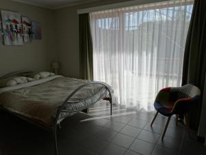 Postel nebo postele na pokoji v ubytování Vakantieverblijf Berg en Dal
