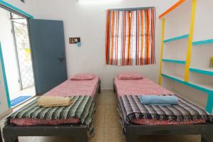 Postel nebo postele na pokoji v ubytování Shaman House