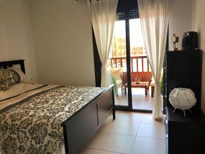 A bed or beds in a room at El Mocan Luxury Apartment