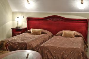 
Łóżko lub łóżka w pokoju w obiekcie Willa Pod Zamkiem
