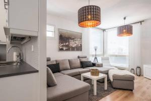 a living room with a couch and a table at Villa Seminaari in Raahe