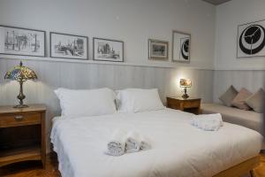 Postel nebo postele na pokoji v ubytování Seven Suites Pieve