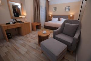 Postel nebo postele na pokoji v ubytování Mado Hotel