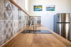 A kitchen or kitchenette at Levkosh Apartments at Lefkada's Heart