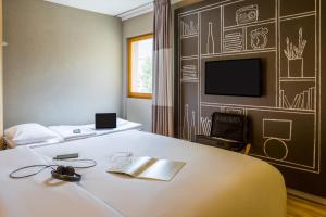 Camera con letto e TV di Ibis Sion a Sion