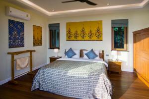 Ένα ή περισσότερα κρεβάτια σε δωμάτιο στο Villa Moonstone +31 φωτογραφίες