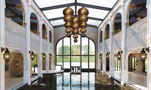 a large hallway with a chandelier in a building at Hotel Umberto in Wijchen