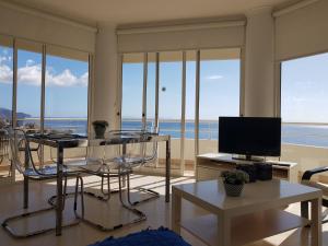 a living room with a view of the ocean at The Sunrise of your Dreams with Total Ocean View in Funchal