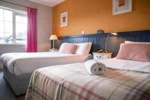 Letto o letti in una camera di Emmet Hotel