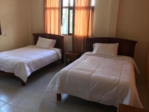 Postel nebo postele na pokoji v ubytování Hosteria Shell