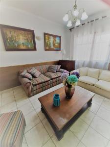 a living room with a couch and a coffee table at Hotel Vista Hermosa 17 in Viña del Mar