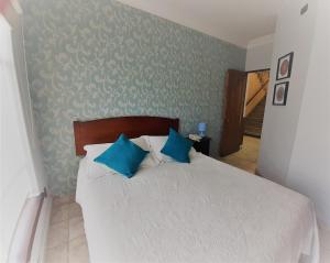 Postel nebo postele na pokoji v ubytování Hotel Vista Hermosa 17