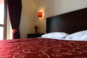 Letto o letti in una camera di B&B Muro Torto Lucera