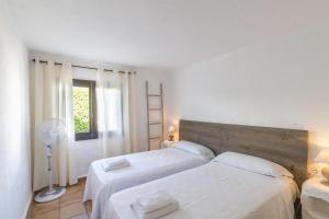 Posteľ alebo postele v izbe v ubytovaní Villa Bini Andu