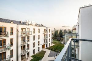 a view from the balcony of a building at Apartments Gdańsk Kochanowskiego by Renters in Gdańsk