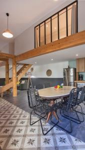 a dining room with a table and chairs at Laniella location in Calvi