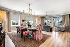 a dining room with a table and chairs at Reflections at Bay Point in Panama City Beach