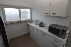 Kuchyň nebo kuchyňský kout v ubytování AB Apartment 06